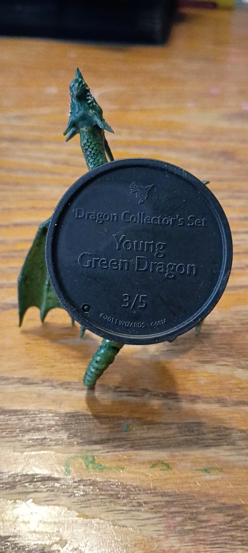 Base label reading Dragon Collector's Set, Young Green Dragon, 3/5